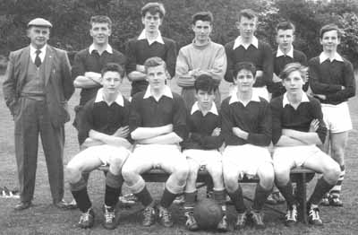 West End United 1962
Helensburgh's West End United football team which took part in the Gareloch League, which also included teams from the Faslane base, Arrochar, Garelochhead, Rosneath and Kilcreggan. The club was run by secretary Jimmy Shields for ten years, and after his death the team folded. They are at Hermitage playing fields, June 11 1962. Sitting: I.McFadyen, D.Smith, M.Gray, A.Moffat, M.Trueman; standing: Mr Shields, P.Robertson, R.Don, C.Lawrie, A.McGregor, T.Donaldson, I.McClafferty (captain).
