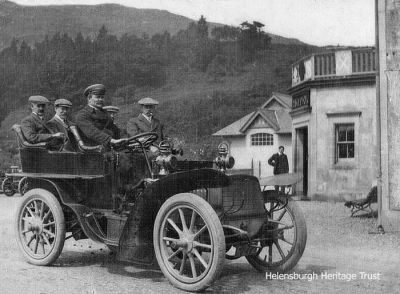 Inspection
A party of local dignitaries on a water reservoirs inspection, arrive at Inverbeg Hotel on Loch Lomondside in 1923. Image supplied by Marlyn Ritchie, whose grandfather David Wilson was the owner and driver of the Packard 15 horse power vehicle.
