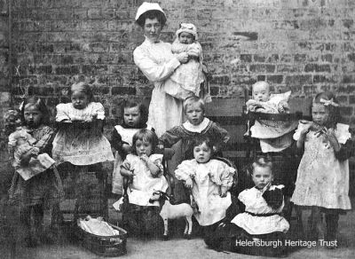 Creche
Maggie Whyte in charge of a creche at Maitland Buildings, Helensburgh. Image, date unknown, supplied by her niece, Marlyn Ritchie (nee Whyte).
