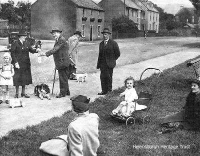 Donation
Dog walker David Wilson donates to a Red Cross collector on the East Esplanade at the foot of Glenfinlas Street. Image, circa 1943, supplied by his grand-daughter, Marlyn Ritchie.
