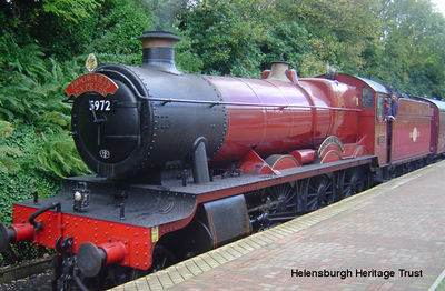 Hogwarts Express
"The Hogwarts Express" is pictured at Helensburgh Upper Station on October 9 2007, returning south after filming one of the Harry Potter films. The steam locomotive No. 5972 was built as "Olton Hall" for the Great Western Railway in 1928, but for the purpose of filming was renamed "Hogwarts Castle". Image supplied by Stewart Noble.
