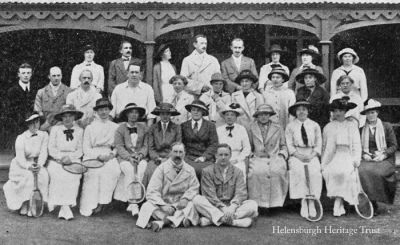1913 Helensburgh Lawn Tennis Club
Back: Miss Lilley, G.Schoelles, Miss Raeburn, R.T.Templeton (Hon Sec), J.H.Strang, Miss Mackay, Mrs A.M.Stewart, Miss Macnab; middle: Dr Downs, A.G.Shillcock, J.W.Swinburne, Sheriff Blair, Miss Rodger, Miss V.MacBrayne, Mrs Strang, Mrs Hardcastle, Miss Preston, Miss Mackay; front: Miss Hamilton, Miss Douglas, Miss R.I.Templeton, Miss MacBrayne, Miss E.MacPhee, Miss Sewell, Miss Marsters, Miss M.A.Young, Miss Sidebottom, Miss F.Smith, Miss MacPhee; on ground: G.E.Fleming, J.G.Anderson. Image dated September 1913. 
