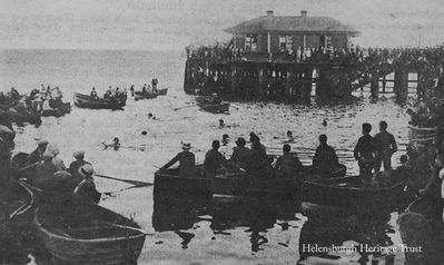 1921 Swimming Gala
The Meechan brothers took this picture of crowds watching a swimming competition on a June Saturday on the east side of Helensburgh pier, 18 years before the town's outdoor swimming pool opened. Some of the boats are the town's old jollyboats, which used to be laid up beside the East Esplanade.
