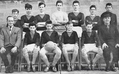 Hermitage under 14s
The Hermitage Academy under 14 'A' football team who won the West Dunbartonshire League in 1962, winning 15 out of 16 matches. Back: G.Don, A.Brabender, A.Quinlan, A.Stimson, K.Thompson, G.Gall, G.McKerrow; front: teacher Mr McKinnon, M.Mickie, A.Sharpe (capt), A.McGougan, S.Colquhoun, janitor and coach Angus McWilliams. Missing from the picture was C.McKell.
