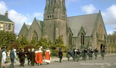 Last Kirking of the Council
The last Provost of Helensburgh, Norman M.Glen CBE, leads the Bailies and members of Helensburgh Town Council to Old and St Andrew's Church (now West Kirk) in Colquhoun Square for the final annual Kirking of the Council service in the spring of 1975 before the council disappeared in the reform of local government. Image by Stewart Noble.
