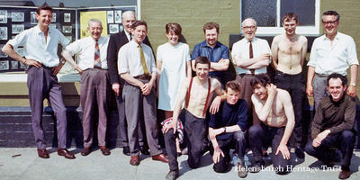 Craig M.Jeffrey Ltd. staff
Staff of Craig M.Jeffrey Ltd., publishers of the Helensburgh Advertiser and the County Reporter and commercial printers, pictured outside the 7-9 East King Street printworks on a sunny day. Standing (from left) are Donald Fullarton, W.T.Slater, Jimmy Allan, Tom McLennan, Norma Jarman, Willie McGillivary, Billy Gilmour, Jim Cavana and proprietor Craig Jeffrey. In front are Stewart Stenhouse, unknown, George Gill and Tony McGinley. Image circa 1970.
