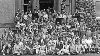Methodist holiday
A group of Methodists of all ages on holiday at Ardenconnel House in Rhu in the mid-1930s. The B-listed mansion was built by the Buchanan family in the late 18th century, and Ardenconnel was one of the principal estates of the old parish of Row. It was bought in 1899 by the Countrywide Holidays Association, and by 1908 could accommodate 120 guests. The CHA is the oldest walking holiday company in the country, set up in 1893 to encourage participation in, and enjoyment of, the countryside, and to this day, while no longer operating walking holidays, is still working hard to fulfil the vision of founder the Rev T.A.Leonard. The mansion was later converted into modern flats. Image by Jean M.Watson.
