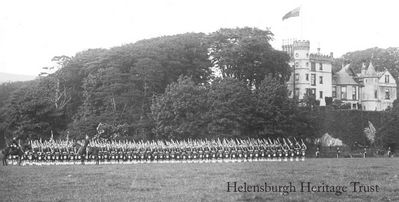 Argylls at Ardencaple
The Argyll and Sutherland Highlanders â€” possibly Dunbartonshire Rifles (8th/9th Battalion Argylls) â€” parade in the field below Ardencaple Castle, Helensburgh. Image date and other details unknown. Please email the website editor, using the Contact Us facility on the main website, if you can provide any more information.
