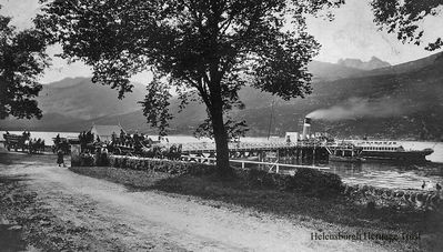Arrochar Pier
Carriages arrive with passengers for a steamer â€” possibly the Marmion â€” berthed at Arrochar Pier, which was built in 1850 and used to service several steamers daily with visitors from Glasgow, circa 1913. Image supplied by Jim Chestnut. 
