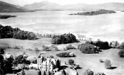 Auchendennan
Auchendennan House was from 1945 to 2013 a Youth Hostel and is reputed to have its own ghost. This view, circa 1956, shows Loch Lomond and Inchmurrin island beyond. Used for hunting by Robert the Bruce when he lived at Cardross, and then a church possession of Dunbarton, Auchendennan was feued about the time of Flodden to one of the Dennistouns, Andrew of Cardross, whose descendants held it for 100 years and then the Napiers of Kilmahew for another 100 years. The present mansion was built in 1867 by Glasgow merchant George Martin, and it is now back in private ownership.
