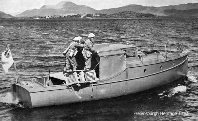 The Balloch Navy
World War Two Home Guard security extended around Loch Lomond, where the Rhu-based Marine Aircraft Experimental Establishment conducted top secret trials, but this was not the responsibility of MAEE. The fear was that German seaplanes might land on Loch Lomond, especially at night, so the â€˜Balloch Navyâ€™ patrolled the loch in requisitioned motorboats which were armed and flew the white ensign. Image by courtesy of Iain McAllister from the Silver Motor Yachts private Facebook group.
Keywords: Balloch navy
