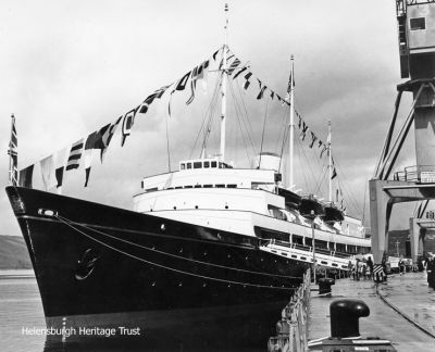 Royal Yacht
The Royal Yacht Britannia moored at the Clyde Submarine Base at Faslane in May 1968 for the visit of the Queen Mother. Photo by Hector Cameron.

