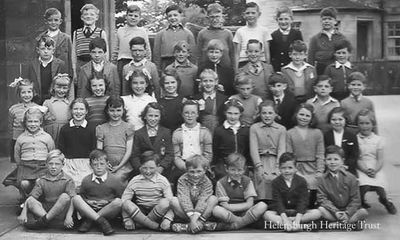 Clyde Street School 1953-4
A picture of a class at Helensburgh's Clyde Street School. Image supplied by Alex Hunter, Ontario, Canada, who is in the third row, second from the right. In the second row, fourth from left, is Mary MacKinnon, and on the extreme left of the front row is Joe McKell who went on to become a well known local footballer. Alex thinks the teacher was Miss Minto, and would welcome any more information. 
