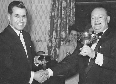 Award for ex-Provost
A former Cove and Kilcreggan Provost, Billy Cowan, receives a trophy from Eric Hope at the annual Cove Sailing Club prizegiving dance in March 1966.
