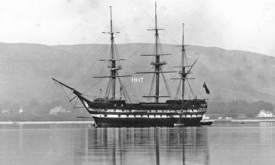 T.S. Cumberland
TRAINING SHIPS were moored in the Gareloch off Kidston Point from 1869 for 54 years. The first was HMS Cumberland, after which Cumberland Avenue in Helensburgh and the much older Cumberland Terrace in Rhu were named. Built in 1842 at Chatham, she was a 2,214-ton two-deck 70-gun man o'war, 180 feet long, with a crew of up to 620 men. In 1869 she was taken over for use as a training vessel by the newly formed Clyde Industrial Training Ship Association. This image, one of only two known images of the vessel, is reproduced by kind permission of Dundee City Archives. The other can be seen on the Trust website.
