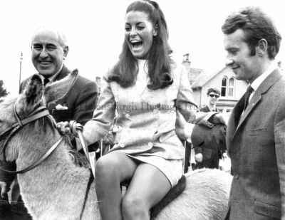 Lions Carnival
Miss Great Britain, Jennifer Gurley, is with Helensburgh Lions Club members Provost J.McLeod Williamson and Alan Wylie at the Lions Club's Carnival and Donkey Derby in East King Street Park in July 1968. In the background is another Lions Club member, Stewart Walker.
