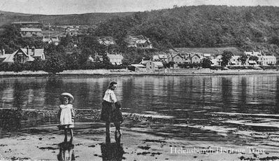 Garelochhead East
Two children paddle in the Gareloch, with east Garelochhead beyond. Image circa 1919.
