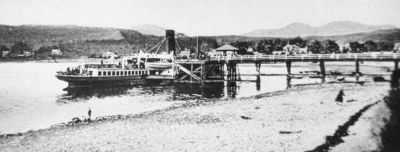 Steamer at Garelochhead Pier
A steamer is berthed at the pier at Garelochhead, probably the Lucy Ashton which called regularly from 1906 until the pier closed in 1939. Image circa 1905.
