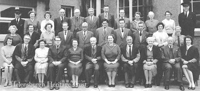 Hermitage staff
Members of the staff of Hermitage School in East Argyle Street in the early 1960s. Back: Mr MacPhail, Miss Jamieson, unknown, Mr Patteson, Dr Simpson, Mr Brown, Archie Leitch, Mr Mackinnon, Mrs McLuskey, Miss Knox, Miss Wiltshire, Angus McWilliams; middle: Mrs Younger, Miss Howieson, Mrs Hier, Bill Yule, unknown, Mr Deuchars, Mr Smith, unknown, Mrs Betty Spy, Miss Henderson; front: unknown, Tom Murray, Mrs Purdie, Arthur Brocklebank, Miss Lennie, headmaster George Mutch, Miss Mair, David Malan, Miss Munro, Mr Barr, Miss Livesy.
