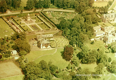 Hermitage Park
An aerial view of Hermitage Park, Helensburgh, showing Hermitage House and the A.N.Paterson-designed War Memorial. Originally the home of the Cramb family, who sold what was then called Cramb Park to the Town Council in 1911 for Â£3,750, the mansion became an annexe to Hermitage School after World War One use as a hospital. After 1926 it became a council workshop and store, and it was eventually demolished in 1963. Image by courtesy of Helensburgh Library; date unknown.
