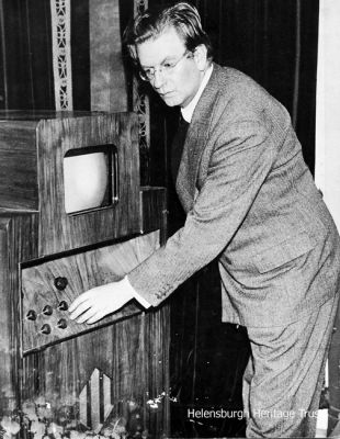 Baird receiver
John Logie Baird is pictured with a C.R.T. receiver, circa 1935.
