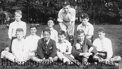 Argyll Street Cricket Club
This is a photo of Larchfield School pupils taken by John Logie Baird in about 1900 at the Larchfield cricket field near the Duchess Wood at Ardencaple. His friend Jack Buchanan, later to become a famous entertainer, is seated on the right with his cap at a rakish angle. Professor Malcolm Baird, who kindly supplied the image, says: â€œThere are ten people in the group, and it is possible that JLB was the 11th member of the team! There is nothing more on record."   
