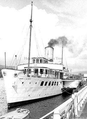 Maid of the Loch
A Hector Cameron photo of the Maid of the Loch at Balloch Pier in August 1970. The 555 ton vessel was the last paddle steamer built in Britain, and the last of a long line of Loch Lomond steamers beginning about 1816. Built by A. & J.Inglis of Glasgow, she was dismantled, shipped by rail to Balloch where the sections were reassembled, and launched on March 5 1953. Her last commercial sailing was in August 1981, and now she is looked after at Balloch Pier by the Maid of the Loch Preservation Society.
