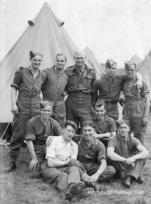 Territorials at camp
Argyll and Sutherland Highlanders Territorials from Helensburgh relaxing at a camp in the late 1930s. Lachie McDonald is second from left back row, while Jimmy Handyside is on the right in the back row. The surname of the man at the left end of the front row is believed to be MacFarlane. Image supplied by Mrs Betty Stewart.
