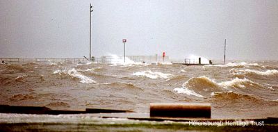 Pier awash
Helensburgh pier is underwater during a storm in January 1999. Photo kindly supplied by Iain Duncan.

