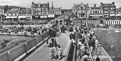Packed pier
Helensburgh pier, outdoor pool and seafront are packed on a sunny summer day in 1935.
