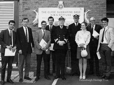 Press at Faslane 1969
Members of the press visit the Clyde Submarine Base at Faslane on June 11 1969. On the left is Bill Heaney (County Reporter, Dumbarton), and beside him is Gerry Fitzgerald (Fitzgerald Owens News Agency, Dumbarton). Fourth from left is Donald Fullarton (Helensburgh Advertiser), and third from right is Angela Sandeman (Helensburgh and Gareloch Times). The naval officers are Commodore Clyde Peter G.la Niece and Commander George Haynes.

