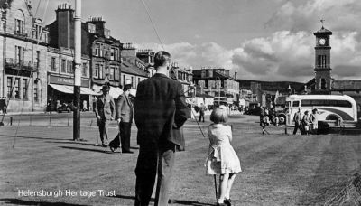 Sunny putting
A bus awaits at Helensburgh pierhead and the putting green is busy on a sunny afternoon. Image c.1966.
