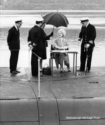 On deck
The Queen Mother signs the visitors book on the deck of a Polaris submarine at the Clyde Submarine Base at Faslane in May 1968. Photo by Hector Cameron.
