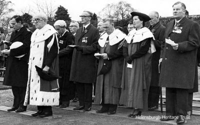 Remembrance Day 1968
The official party at the 1968 Remembrance Day service at the Cenotaph in Hermitage Park. In front are the Commodore Clyde and Provost J.McLeod Williamson. In the row behind are Town Clerk Robert Mackay, Councillor Norman Glen, Bailie John Langan, Bailie Mrs Jae Gardiner, and Councillor Ian Johnston.
