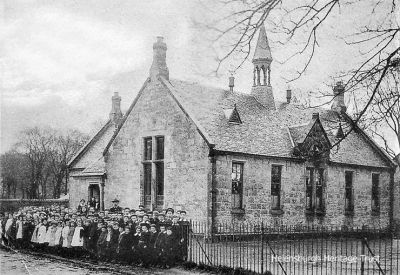 Old Row
Pupils stand outside the original Row (Rhu) School which stood on what is now the village green.
