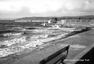 Seafront before reclamation
How Helensburgh seafront and the outdoor swimming pool looked before the major reclamation to form a car park and build the indoor swimming pool. Image, source unknown, supplied by Robert Ryan.
