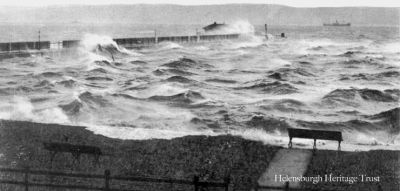 Stormy seafront
This old picture shows the pier and the esplanade being battered by a storm at high tide. Image date unknown.
