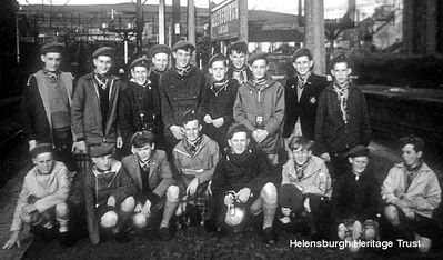 Scouts leave for Switzerland
A group from the 1st Craigendoran Scouts were pictured at Helensburgh Central Station by Henry Fullerton, about to head off for Brienz in Switzerland in 1964. Image supplied by Alistair Quinlan.
