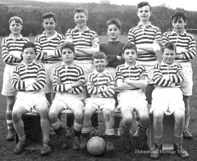 West End United
A 1962-3 West End United boys football team supplied by local man Alistair Quinlan who, aged about 13, was in the team which played a one-off charity match at Ardencaple organised by a father to raise funds for his ill son. Opponents Kirkmichael United won by a handsome score. Back: Gordon Smith, Richard Johnson, Ian Gilchrist, Hugh Jordan, Alastair Quinlan, Delford Lenk; front: Frank Lenk, Peter Jordan, the boy for whom it was arranged, Bill McEwan, ?.
